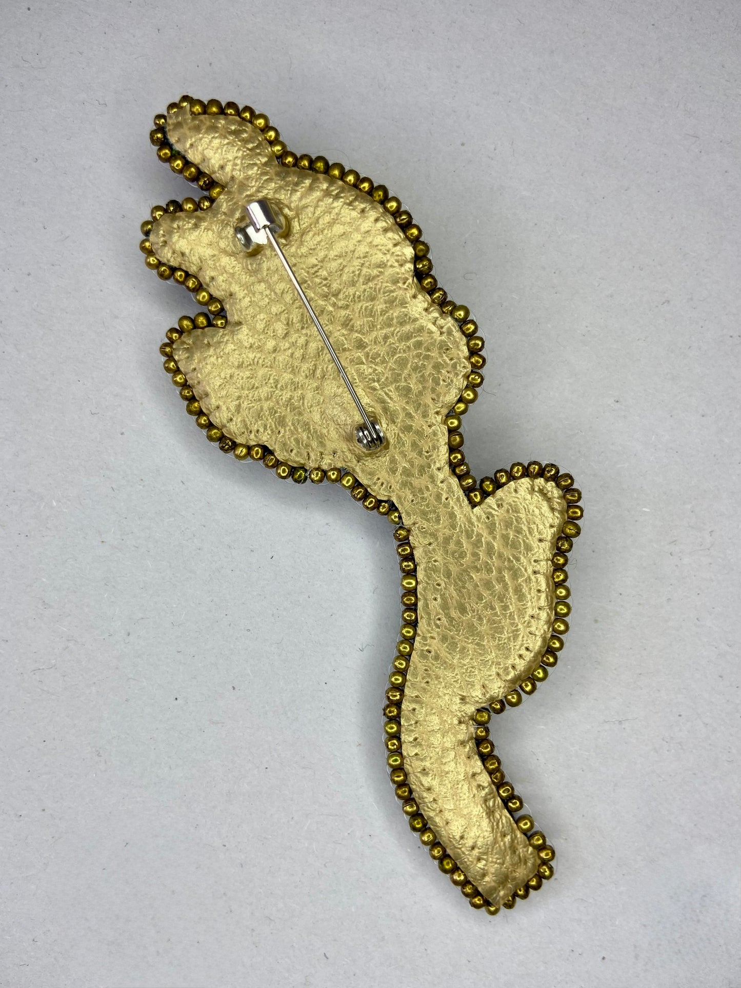 Broche Bouton incandescent